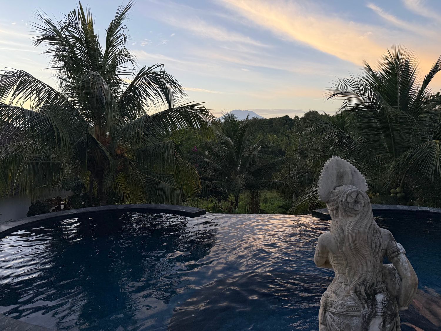 When the clouds go away, you can see the volcano on Bali in the distance.